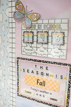 a bulletin board with the words seasons and fall written on it, in front of a butterfly themed wall