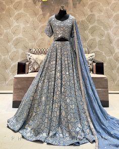 Made to Order/Measurement/Custom Order Lehenga - Color : Gray blue - Fabric : Embroidered Georgette - Fully flared paneled lehenga - Embroidered  Blouse -  Georgette  Dupatta with Border - Drawstring closure with Tassels - - It can be customize in any design or size  PLEASE NOTE: BUYERS ARE RESPONSIBLE FOR ANY CUSTOMS AND IMPORT TAXES THAT MAY APPLY. This is a made to order product. If you opt for 'Made To Measurement Option', we will provide a measurement template and you can share the measurem Types Of Indian Dresses Names, Lehengas For Wedding, Designer Fitted Lehenga With Gota Work, Fitted Designer Lehenga With Gota Work, Fitted Lehenga With Gota Work For Designer Wear, Wedding Party Wear Salwar Kameez With Gota Work, Party Wear Salwar Kameez With Gota Work For Wedding, Silver Unstitched Blouse Choli For Wedding, Silver Unstitched Choli For Wedding