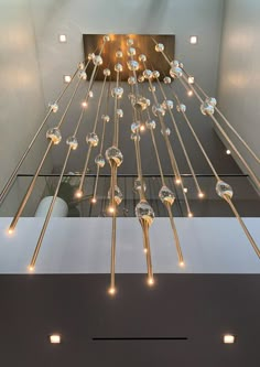 a chandelier with lights hanging from it's sides