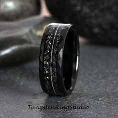 "Real Gibeon Meteorite Debris, Authentic Guitar String and Black Sand Star Inlaid Sandblasted Black Tungsten Ring Why Choose Us For Your Wedding Ring? - Rings built to wear 24/7 - No need to maintain, no special instruction - FREE Engraving service - FREE Ring Sizer service - FREE luxury zebra wood box - LIFETIME WARRANTY - Excellent customer service PRODUCT DETAILS THE PRICE IS FOR ONE RING ONLY Metal : HAMMERED BLACK IP TUNGSTEN CARBIDE, NICKEL FREE, COBALT FREE Inlay: REAL GIBEON METEORITE DE Meteorite Wedding Rings, Black Tungsten Rings, Meteorite Ring, Tungsten Wedding Rings, Black Tungsten, Wolfram, Tungsten Ring, One Ring, Mens Wedding Rings