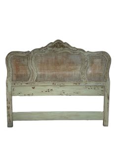 an old white headboard with wickers on the top and bottom, against a white background