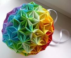 a multicolored origami ball sitting on top of a white countertop