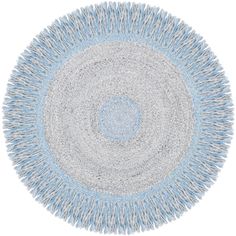 a blue and white rug with fringes on the bottom, in an oval shape