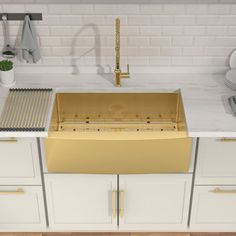 an image of a kitchen setting with gold sink