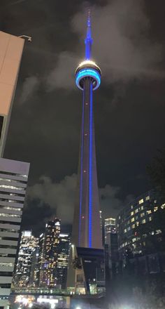 the space needle lit up in blue and white