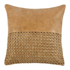 a tan pillow with a brown leather insert on the front and back side, sitting on a white background