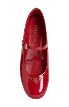 Prada's iconic triangular logo brands this ballet-inspired mary jane crafted of glossy calfskin leather in a fiery hue. Adjustable strap with buckle closure Leather upper and lining/rubber sole Made in Italy Designer Shoes Prada Ballet Flats, Prada Shoes Women, Prada Mary Jane, Gucci Outfit, Kylie Francis, Iconic Shoes, Designer Flats, Stunning Shoes, Design Shoes