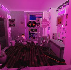 a room with pink lighting and various objects