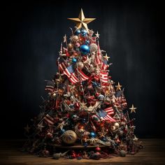 a christmas tree decorated with american flags and other holiday decorations on a wooden table in front of a black background