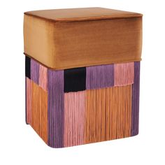 a small stool made out of wood with fringes on the top and bottom part