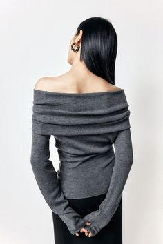 Embrace Elegance with Soft Wool Blend Crafted from a finely spun sheep wool blend, this sweater offers superior elasticity and flexibility with a soft, skin-friendly feel. Featuring a tailored fit that hugs the body's curves without constriction, and an elongated length for slimming effect. The fold-over off-the-shoulder neckline adds dimension and can be worn as a diagonal or straight across the shoulders, highlighting the collarbone and slender arms. The sleeves are specially extended to enhan