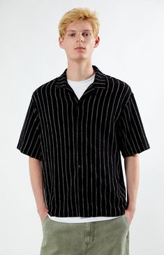 Stay effortlessly stylish with PacSun's Striped Oversized Camp Shirt. Boasting a classic collared neckline, short sleeves, and button closures, this shirt offers a timeless look with a relaxed fit for ultimate comfort. Designed with stripes, it adds a touch of sophistication to your casual ensemble.


	Collared neckline
	Short sleeves
	Relaxed fit
	Button closures
	Striped
	95% Tencel, 5%spandex
	Machine washable
	Model is wearing size medium
	Model Measurements: 6’3”  Height, 28” Waist, 33.5” Hips Casual Black Shirt With Lapel Collar, Short Sleeve Shirt With Lapel Collar For Summer, Summer Short Sleeve Shirt With Lapel Collar And Placket, Summer Short Sleeve Shirt With Lapel Collar, Lapel Collar Shirt With Placket For Summer, Black Shirt With Placket In Relaxed Fit, Black Lapel Collar Tops For Summer, Summer Shirt With Lapel Collar And Placket, Summer Shirt With Lapel Collar And Placket Detail