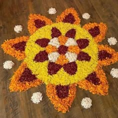 a colorful flower arrangement on the floor with petals