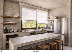 a kitchen with concrete counter tops and wooden stools in front of the bar area