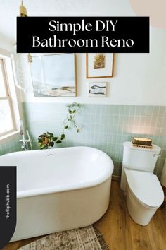 a white bath tub sitting next to a toilet in a bathroom