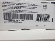 the back side of a white box with a barcode on it's label