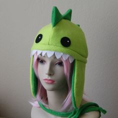 This hat is 100% handmade here in our workshop. One size fits most teens and adults at a standard size of 23" measured around the head. Dinosaur Cosplay, Dinosaur Ideas, Monster Dragon, Dino Tails, Dragon Hat, Alien Hat, Dragon Hats, Dinosaur Hat, Monster Hat