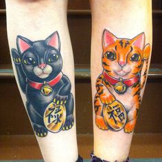 two tattoos on both legs with cats and money in front of them, one has chinese characters