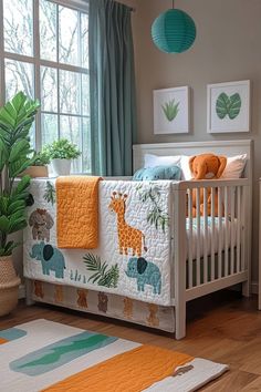 a baby crib with an elephant and giraffe theme