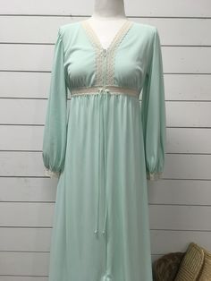 "Vintage Lorraine mint green gown/robe 100% nylon Small Measures 55\" long 17\" underarm to underarm 21\" sleeve Zips partly down Super cute piece Vintage so expected wear Standard age and use wear Good vintage condition See photos for best description" Green Spring Nightgown For Loungewear, Green Long Sleeve Sleep Dress, Green Nightgown For Sleepover, Green Long Sleeve Nightgown For Loungewear, Green Long Sleeve Nightgown For Sleep, Green V-neck Nightgown For Spring, Green Spring Nightgown For Sleep, Green V-neck Nightgown For Bedtime, Green Summer Sleepwear For Wedding Night