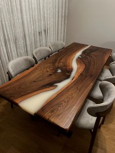 a large wooden table with chairs around it