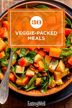 a bowl filled with veggie - packed meals on top of a wooden table