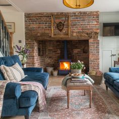 a living room filled with furniture and a fire place