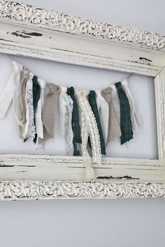 an old white frame with clothes hanging from it