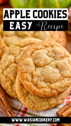 apple cookies are stacked on top of each other with cinnamon sticks and apples in the background