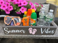 a wooden sign that says summer vibes with sun glasses and flip flops on it