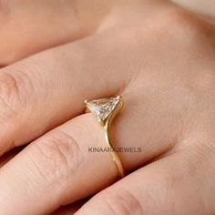 Triangle Moissanite Ring * Triangle Diamond Ring * Solid Gold * Dainty Diamond Ring ● 𝐃𝐢𝐚𝐦𝐨𝐧𝐝 𝐃𝐞𝐭𝐚𝐢𝐥𝐬 > Stone type: Moissanite / Simulated Diamond > Center Stone Shape: Triangle Cut > Weight: 1.00 CT > Stone Color: Colorless > Main Stone Clarity: VVS1 > Cut Grade: Excellent ❤ More Of My Engagement Ring ❤  https://www.etsy.com/shop/kinaarajewels ●  Kinaarajewels Services/Notes  A. Handmade Customized Jewelry. B. More than 50+ Antique and Fancy Cuts and Shapes of Moissanite Diamonds. Ring With Triangle Stone, Triangle Ring Engagement, Triangle Stone Ring, Triangle Diamond Ring, Rare Minerals, Triangle Jewelry, Dainty Diamond Ring, Triangle Diamond, Triangle Ring