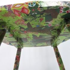 an artisticly designed chair with green and red designs