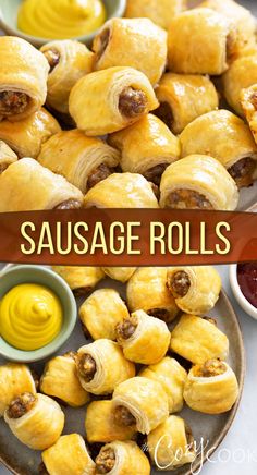 sausage rolls on a plate with mustard and ketchup for dipping sauce in the background