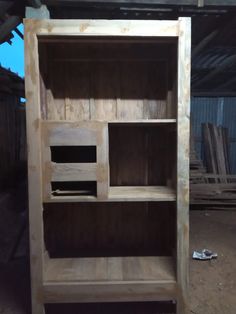 an unfinished bookcase in the process of being built