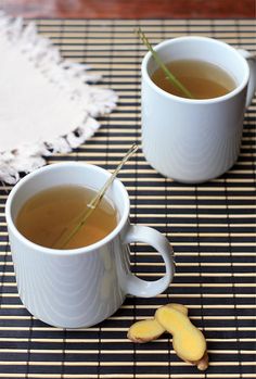 two cups of tea on a place mat