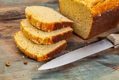 sliced loaf of bread sitting next to a knife