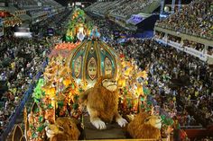 an elaborate float in the middle of a large stadium filled with people and stuffed animals