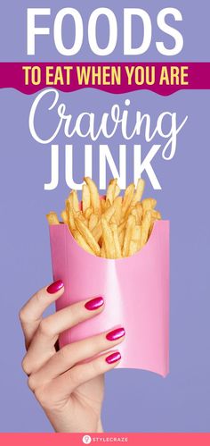 a woman's hand holding up a pink box with french fries in it and the words, foods to eat when you are crazing junk