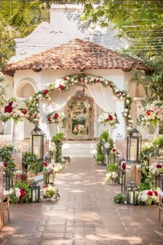 the instagram page on instagram shows an image of a gazebo decorated with flowers and greenery