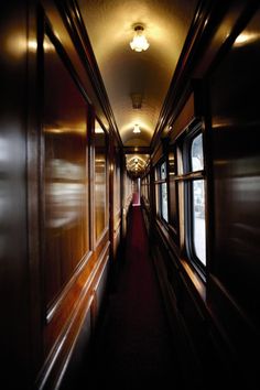 a hallway with the words get on a train and just go anywhere