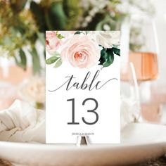 the table numbers are displayed with pink flowers