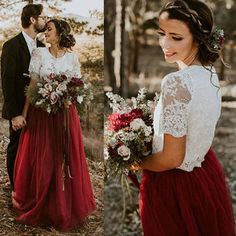 the bride and groom are standing together in the woods wearing long red dresses with lace sleeves