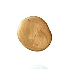 an image of a gold button on a white background