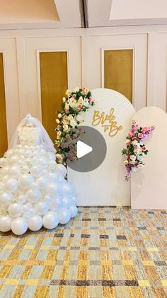 the wedding dress and balloons are on display