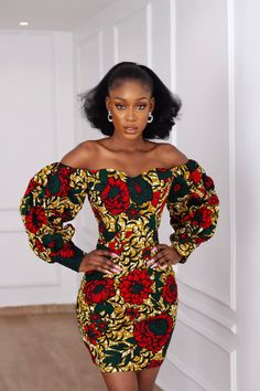 Time to turn it up for party season in this Beautiful African print Ankara Dress. The cut of this dress accentuates the body to a beautiful silhouette and has that perfect short length. Long Bubble sleeves that can be worn on or off-the-shoulder. Sweetheart neckline. Exaggerated sleeves with a cuff. Made with High quality 100% African Wax cotton Fully Lined Long zipper at the back for easy wear Made in Nigeria Models are wearing a US6/UK10 and US14/UK18 Dress Length approx. 37” CARE INSTRUCTIONS Ghanaian Print Dresses, African Bodycon Dress, African Print Birthday Dress, Off Shoulder Ankara Dress Short, One Hand Ankara Dress Styles, Sweetheart Neckline Ankara Dress, African Cloth Dress Styles, Ankara Cute Dresses, African Print Graduation Dress