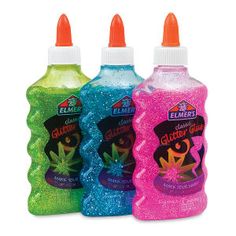 three bottles of liquid with different colors