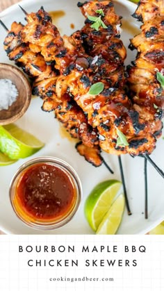 grilled chicken skewers on a plate with dipping sauce