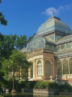 a large building with many windows near water