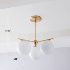 the measurements for a three light chandelier hanging from a ceiling fixture in a living room