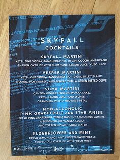 a menu for the skyfall cocktails on a wooden table